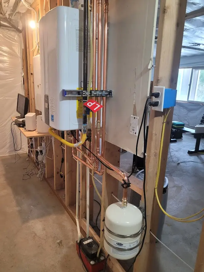 Licensed plumber repairing a kitchen sink in Albuquerque